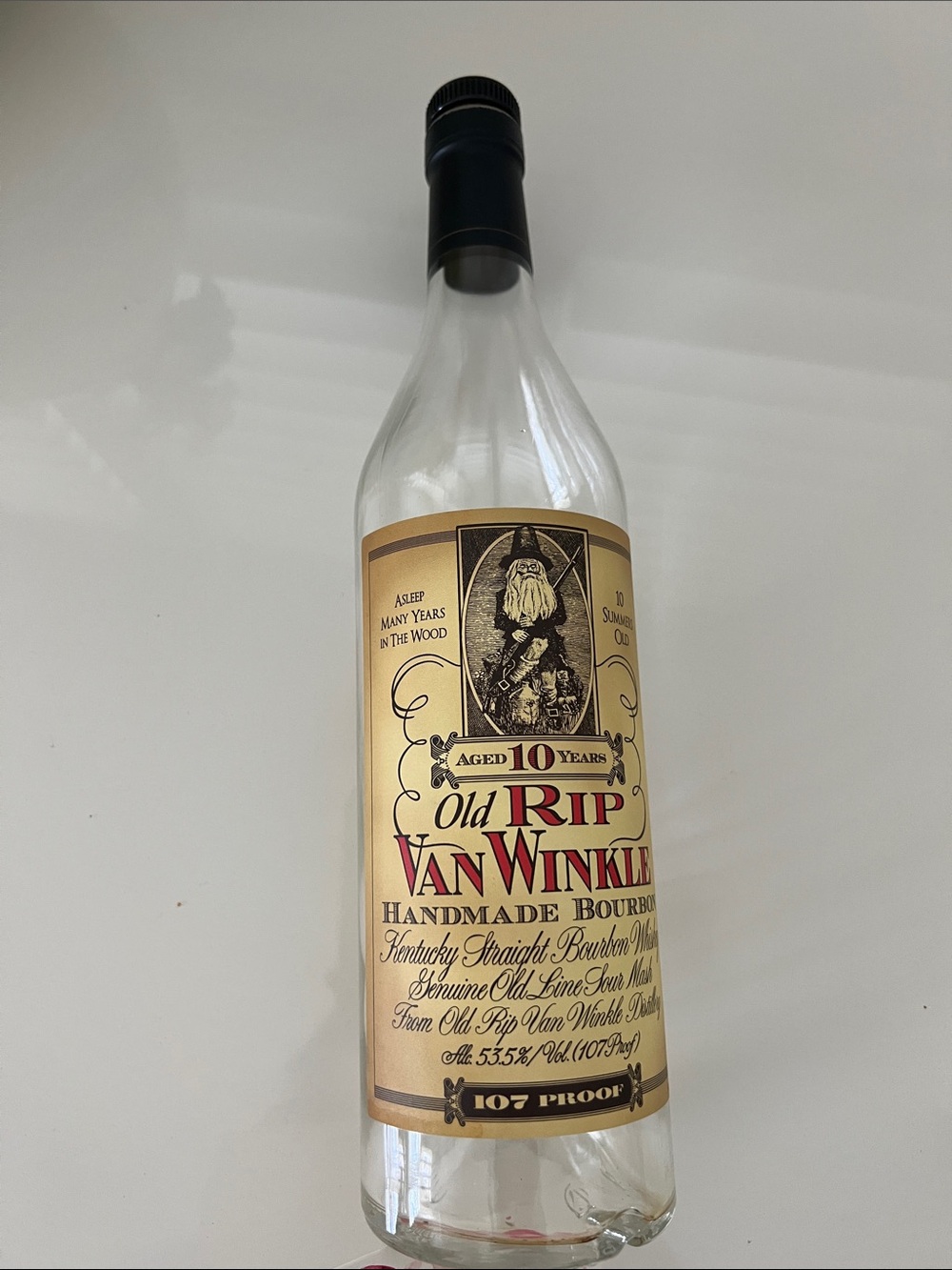 Old Rip Van Winkle Handmade Bourbon - Gold & Black Label empty bottle.